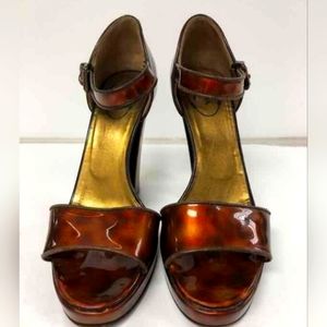 Prada tortoise patent leather pumps